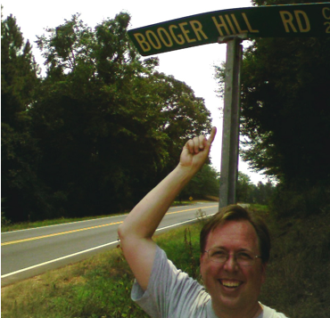 picture of a street sign with the name Booger Hill Road